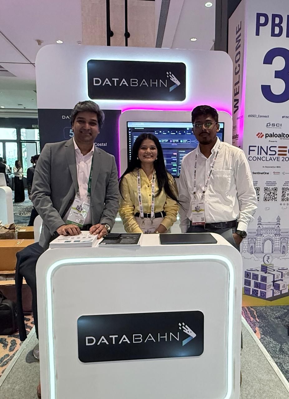 Meera with two colleagues at the DataBahn booth during an APJ industry conference